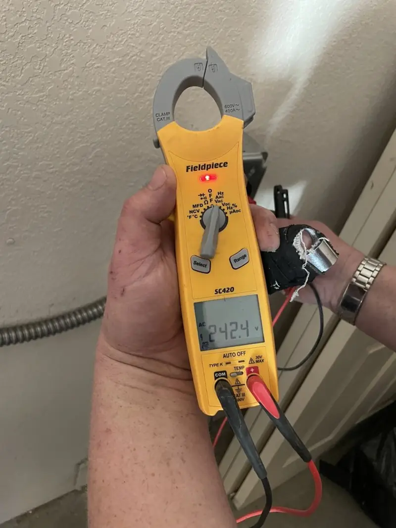 Voltage testing with clamp meter during Recessed Lighting Installation in Blissfield